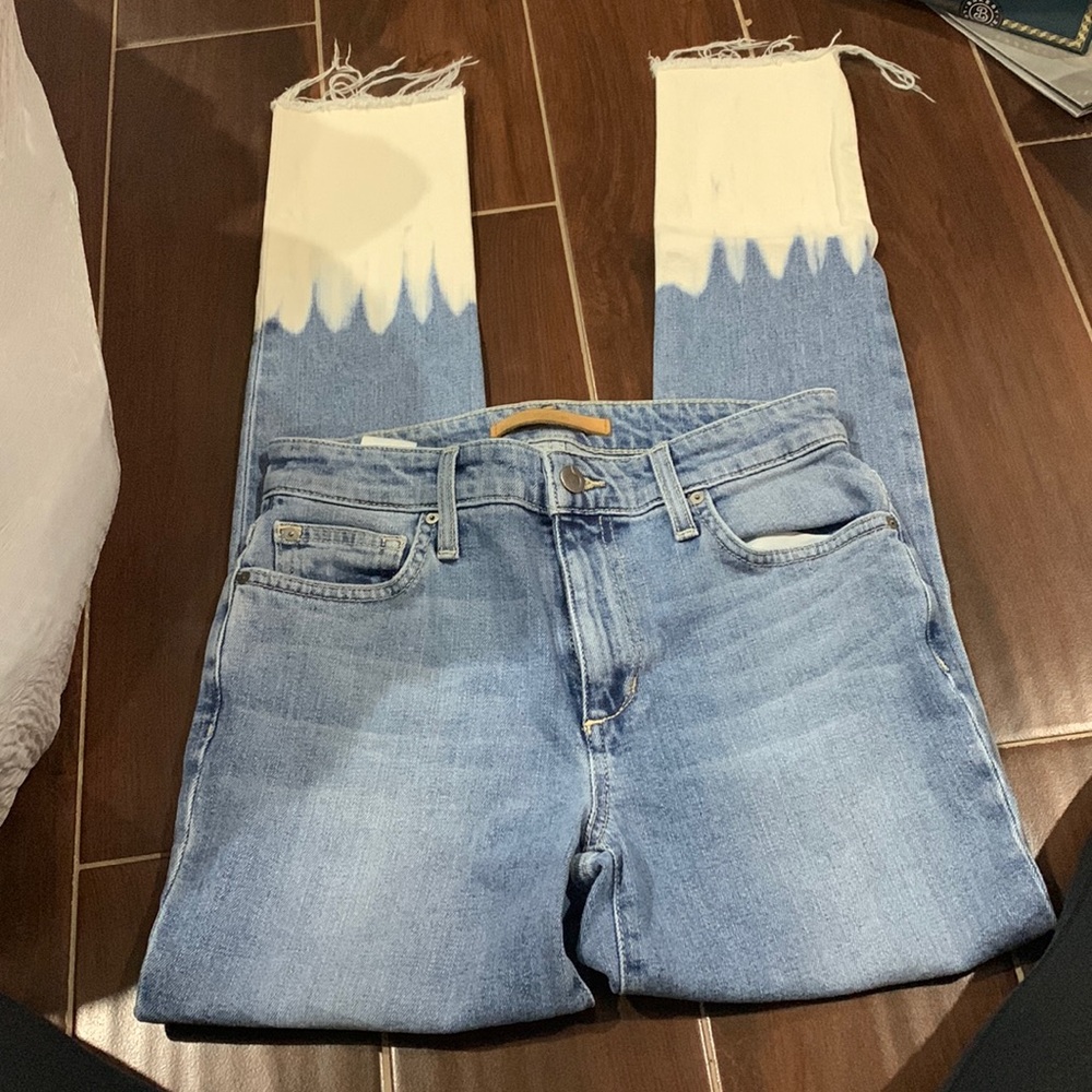 Joes jeans light wash with bleached look on the bottom